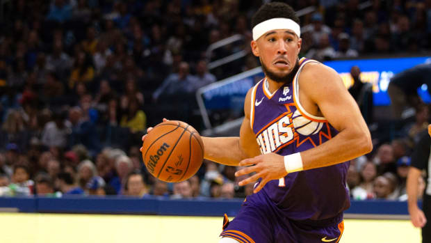 Suns guard Devin Booker drives to the basket